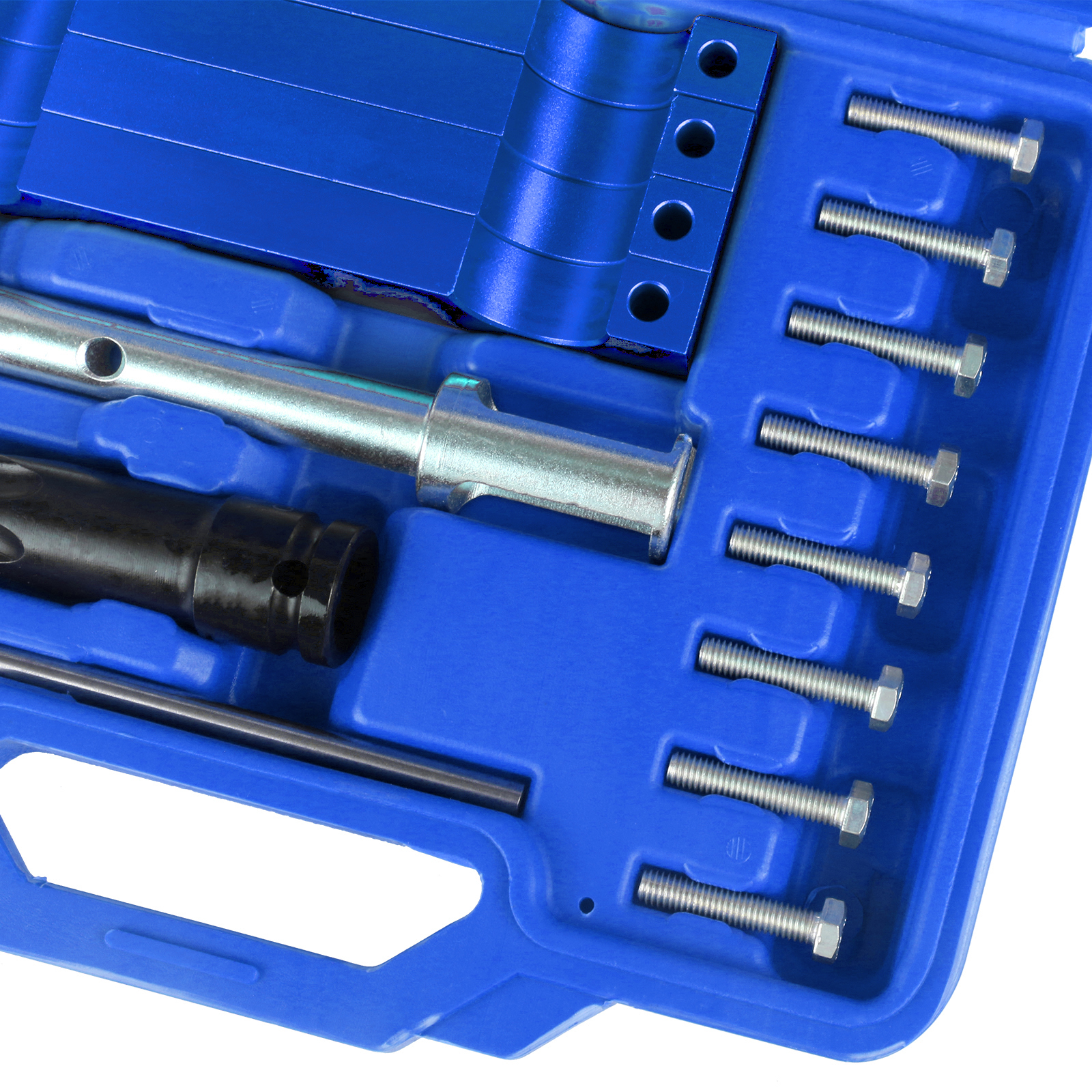 Close-up of the camshaft locking blocks, injector remover and bolts in the case