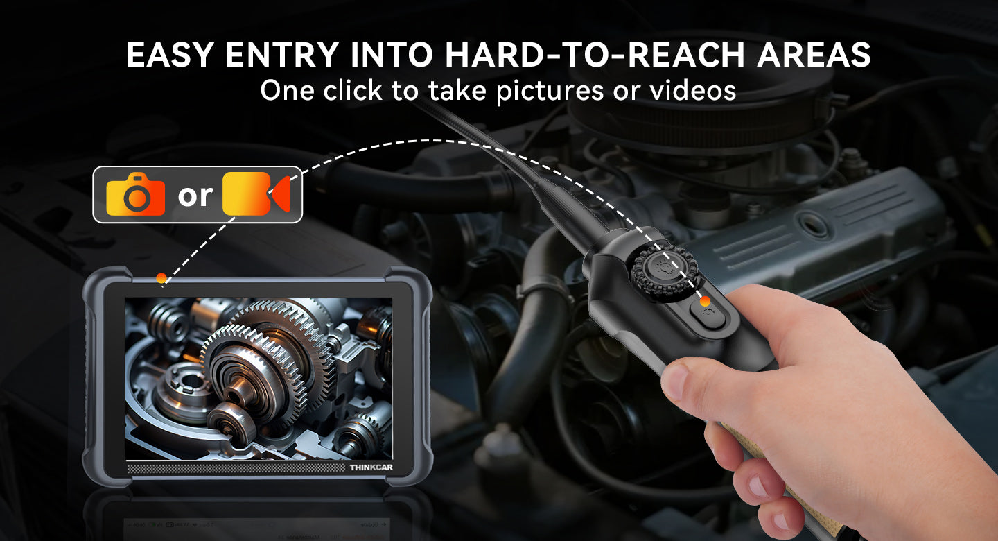 Hand pressing the TES102 snapshot button while a THINKCAR tablet shows the camera image